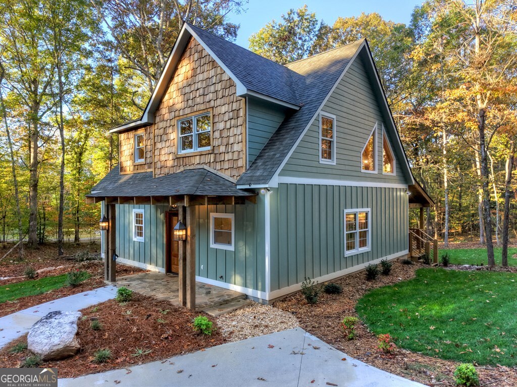 646 High Country Crossing Morganton, GA 30560 - Photo 4 of 44 a front view of a house with garden