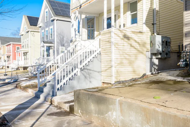 a kitchen with granite countertop a sink and a window