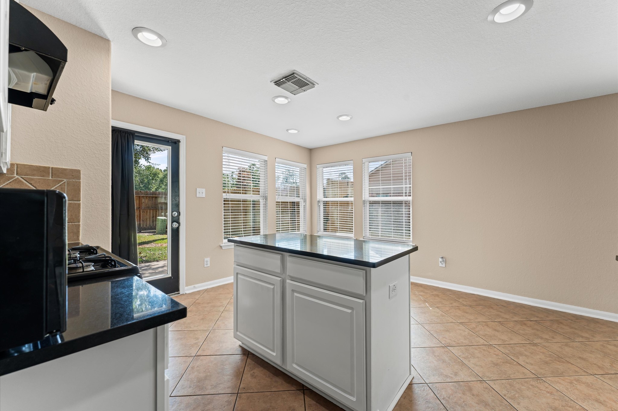 3010 Pathfinders Pass Spring, TX 77373 - Photo 11 of 26 a kitchen with a stove and a refrigerator