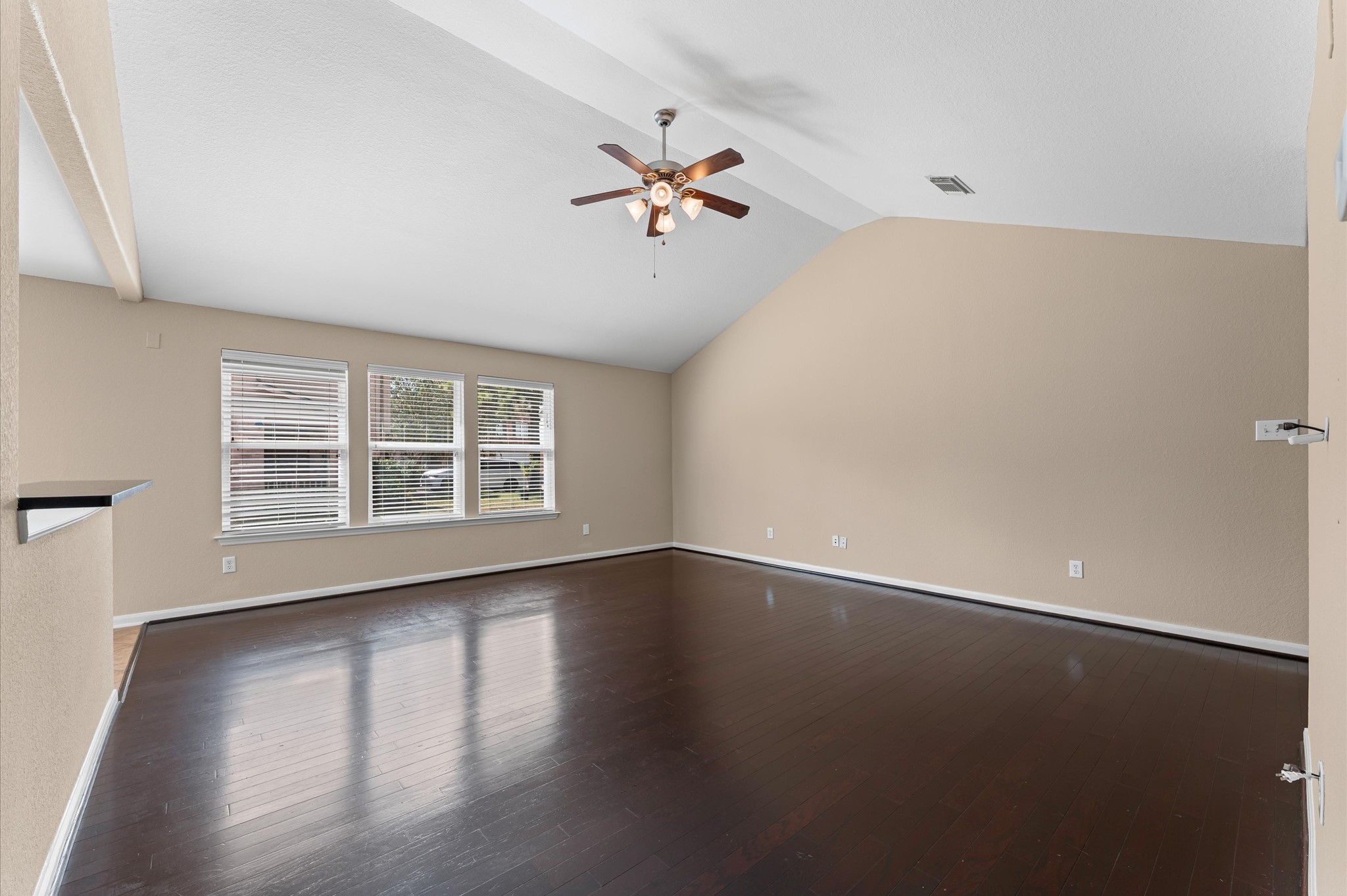 3010 Pathfinders Pass Spring, TX 77373 - Photo 17 of 26 an empty room with wooden floor and windows