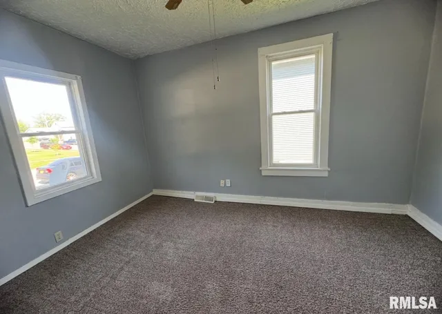 an empty room with windows