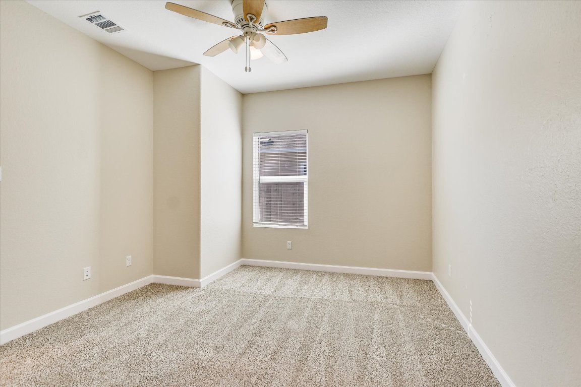 108 Akela Way Georgetown, TX 78626 - Photo 7 of 15 an empty room with a window and a fan