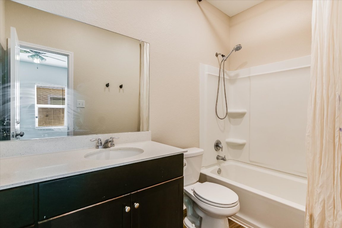 108 Akela Way Georgetown, TX 78626 - Photo 8 of 15 a bathroom with a sink a toilet and shower