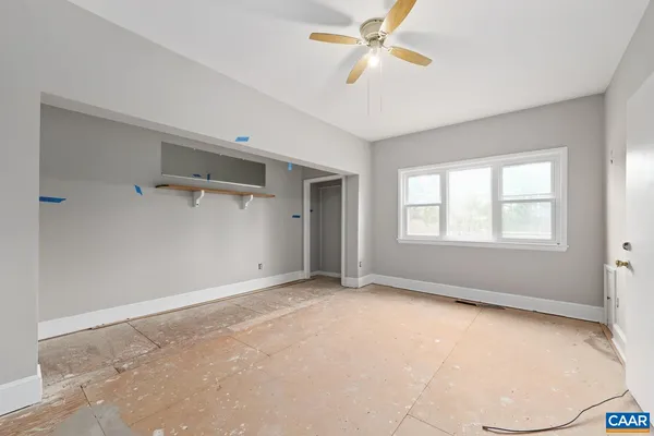 a view of an empty room with a window