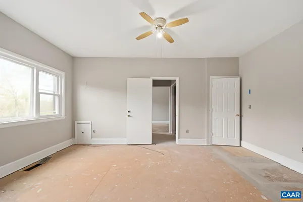 a view of an empty room with a window