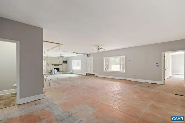 a view of a livingroom with wooden floor and a window