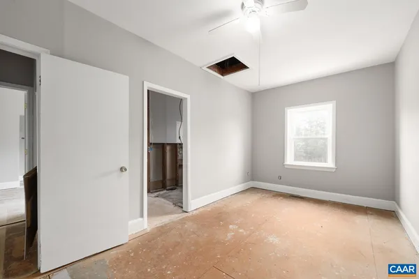 a view of an empty room with a window