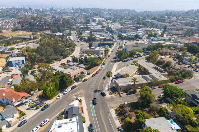 an aerial view of a city with streets and houses