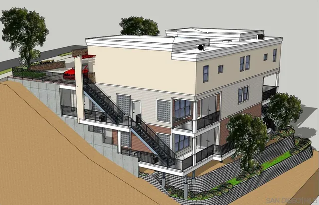 a view of a house with roof deck and iron fence