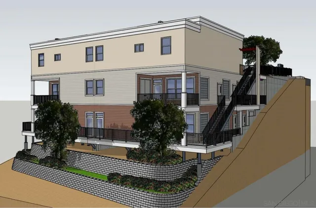 a view of a house with couches and deck