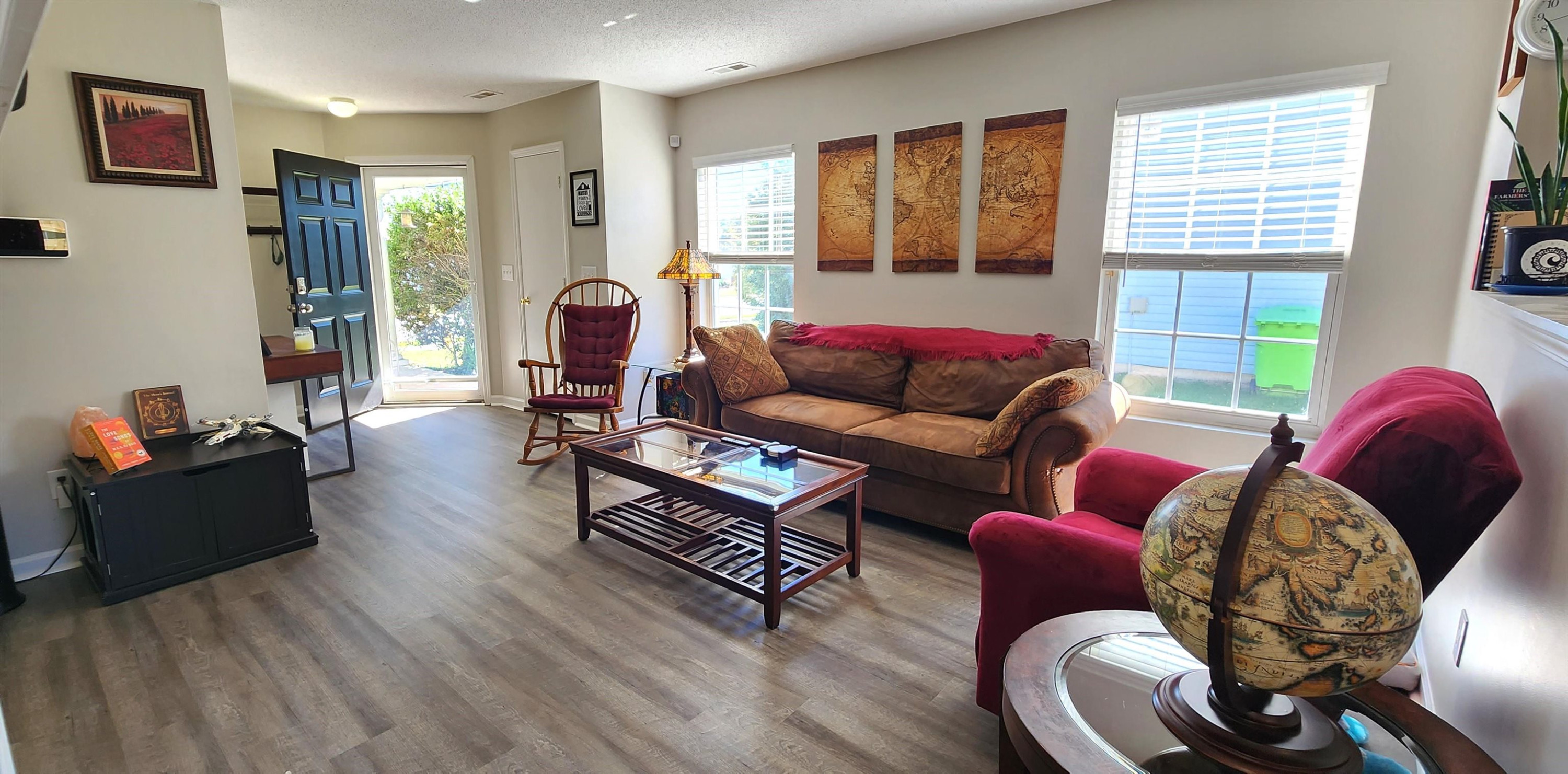 3740 Tryon Ridge Drive Raleigh, NC 27610 - Photo 11 of 20 a living room with furniture and a window