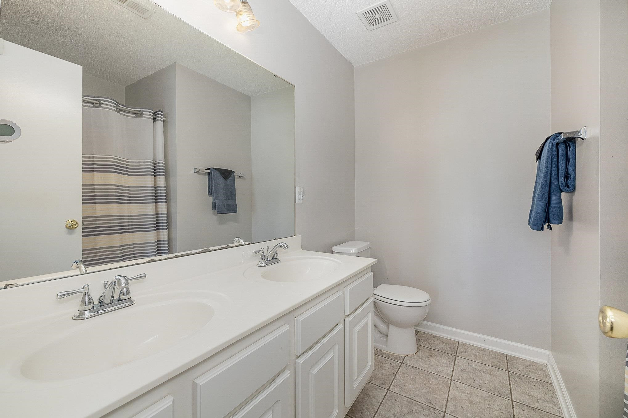 3740 Tryon Ridge Drive Raleigh, NC 27610 - Photo 15 of 20 a bathroom with a sink toilet and shower