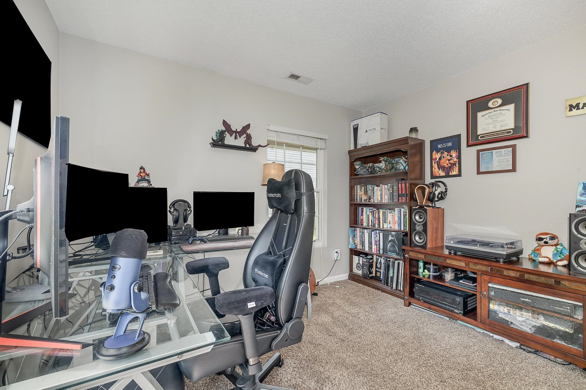 3740 Tryon Ridge Drive Raleigh, NC 27610 - Photo 17 of 20 a view of a livingroom with furniture and a flat screen tv