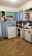 a kitchen with a stove and a microwave