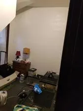 a bathroom with a toilet and a shower curtain