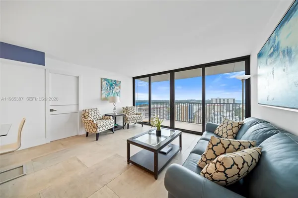 a living room with furniture and a large window