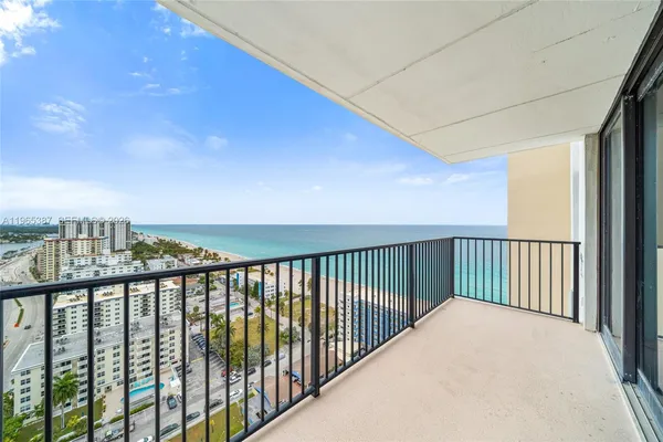 a view of a balcony with city