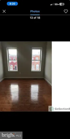 a view of a floor to ceiling room and hardwood floor