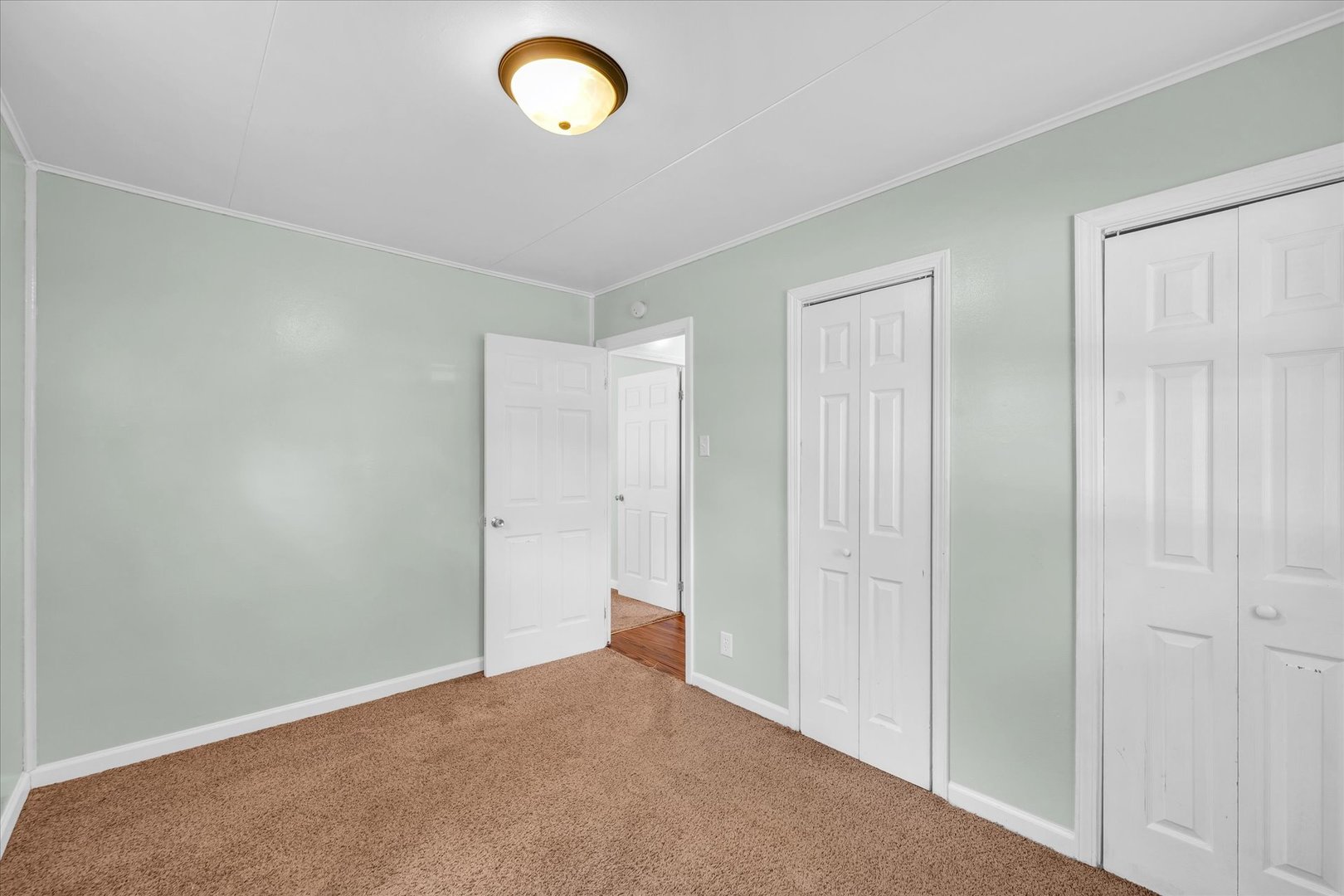 1345 Sunset Drive Rantoul, IL 61866 - Photo 15 of 22 a view of an empty room and a window