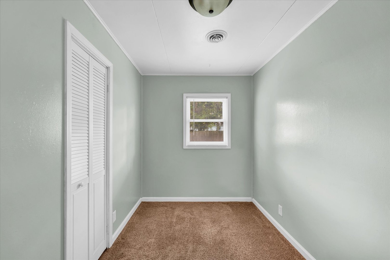 1345 Sunset Drive Rantoul, IL 61866 - Photo 16 of 22 an empty room with windows