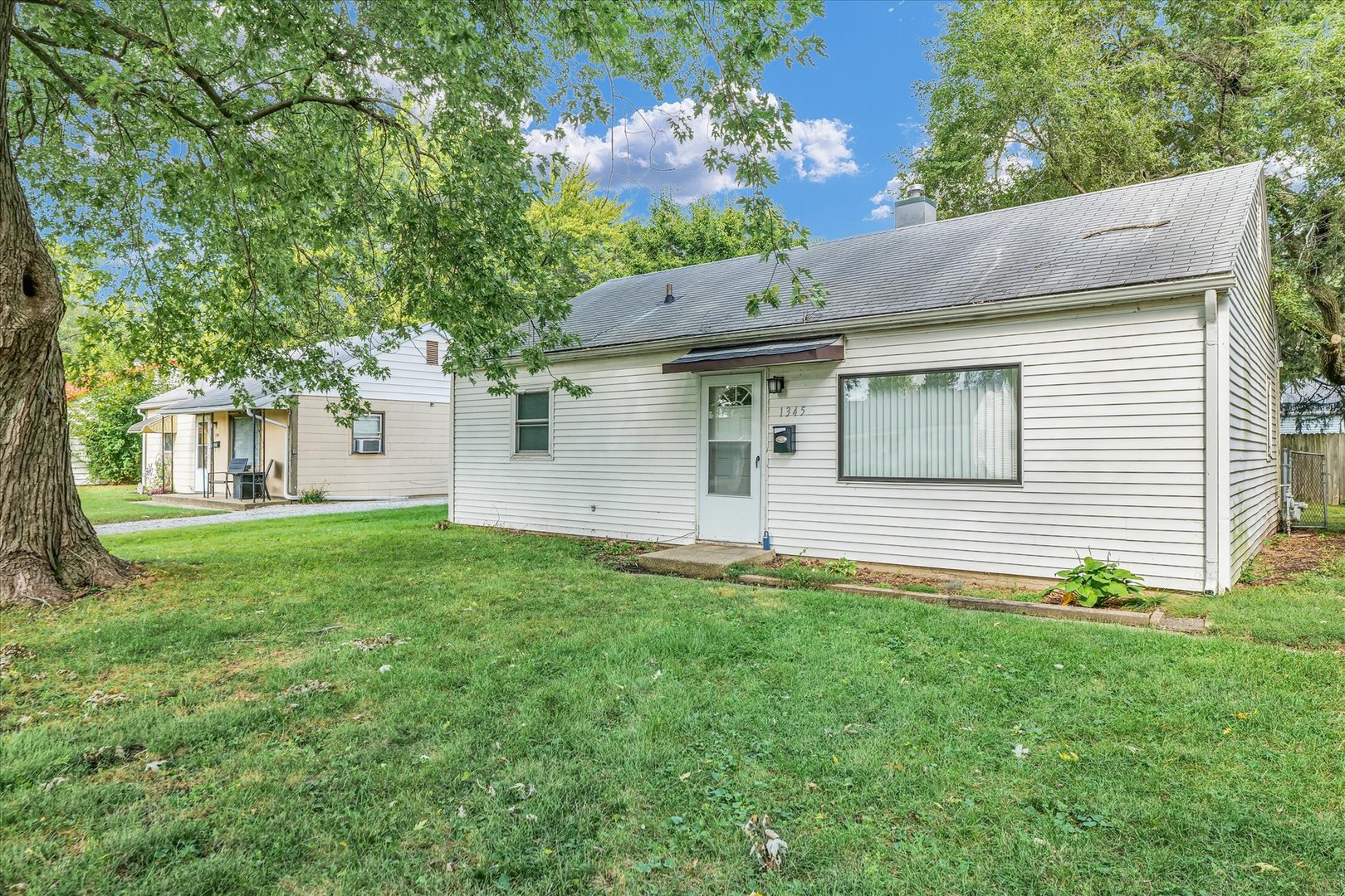 1345 Sunset Drive Rantoul, IL 61866 - Photo 2 of 22 a front view of house with yard