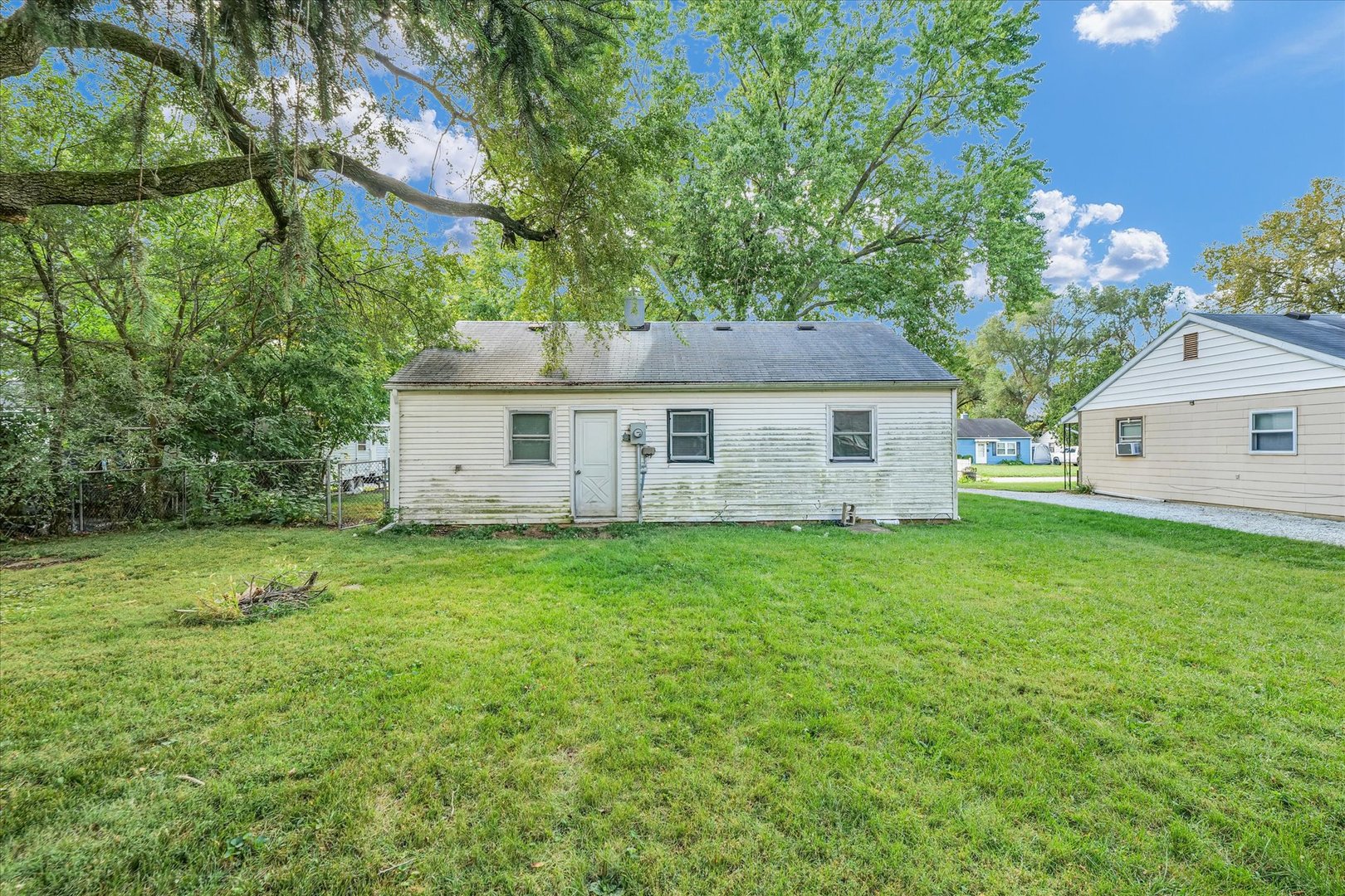 1345 Sunset Drive Rantoul, IL 61866 - Photo 21 of 22 a view of a house with backyard and garden