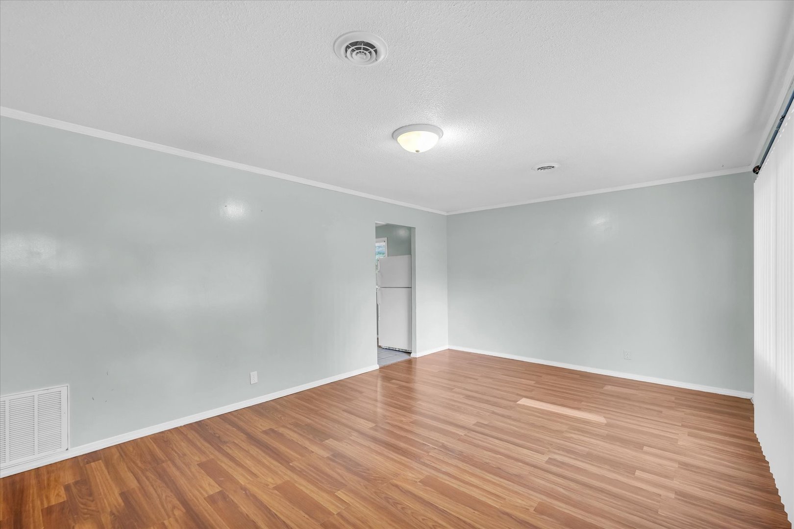 1345 Sunset Drive Rantoul, IL 61866 - Photo 5 of 22 a view of empty room with wooden floor