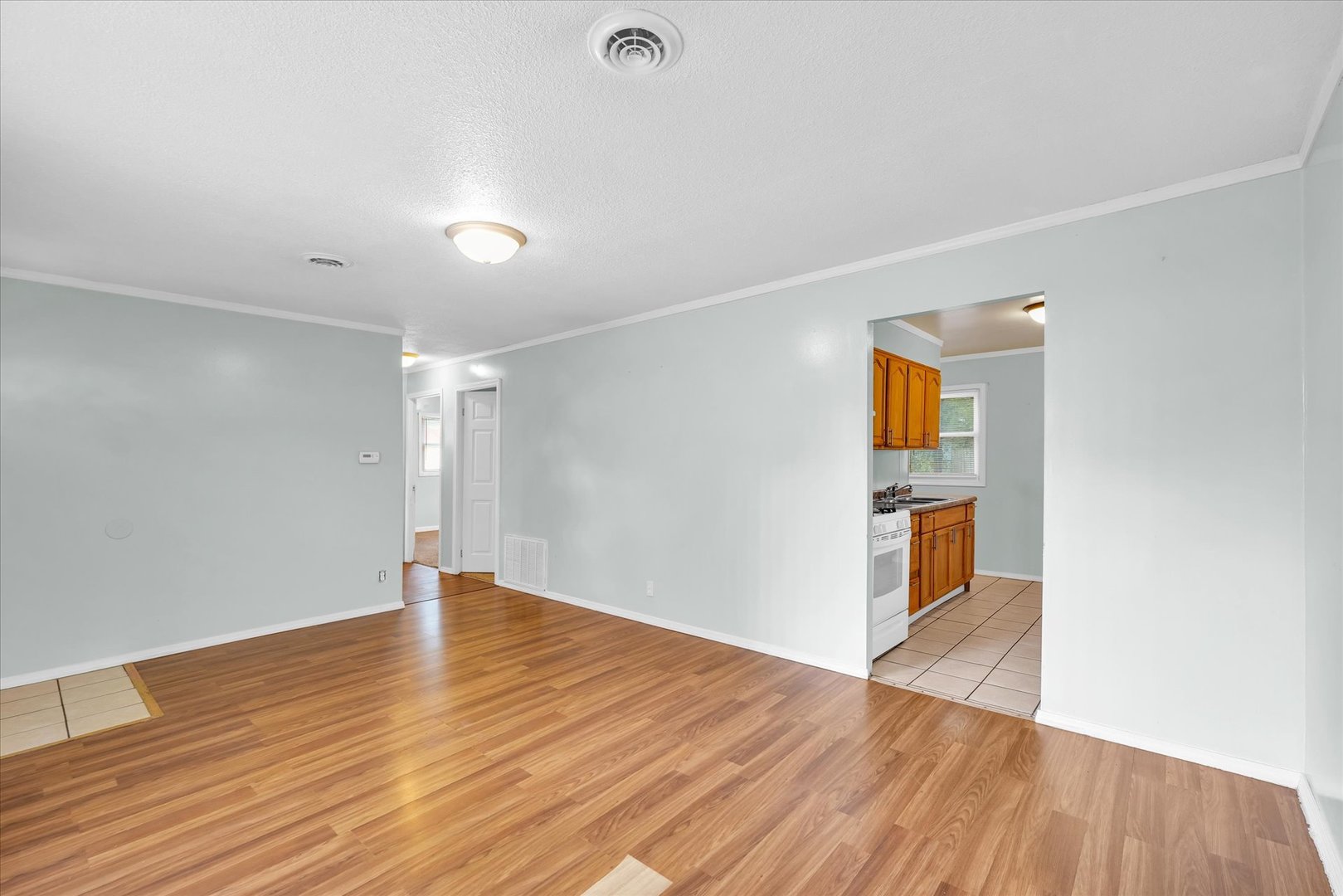 1345 Sunset Drive Rantoul, IL 61866 - Photo 6 of 22 a view of an empty room with wooden floor