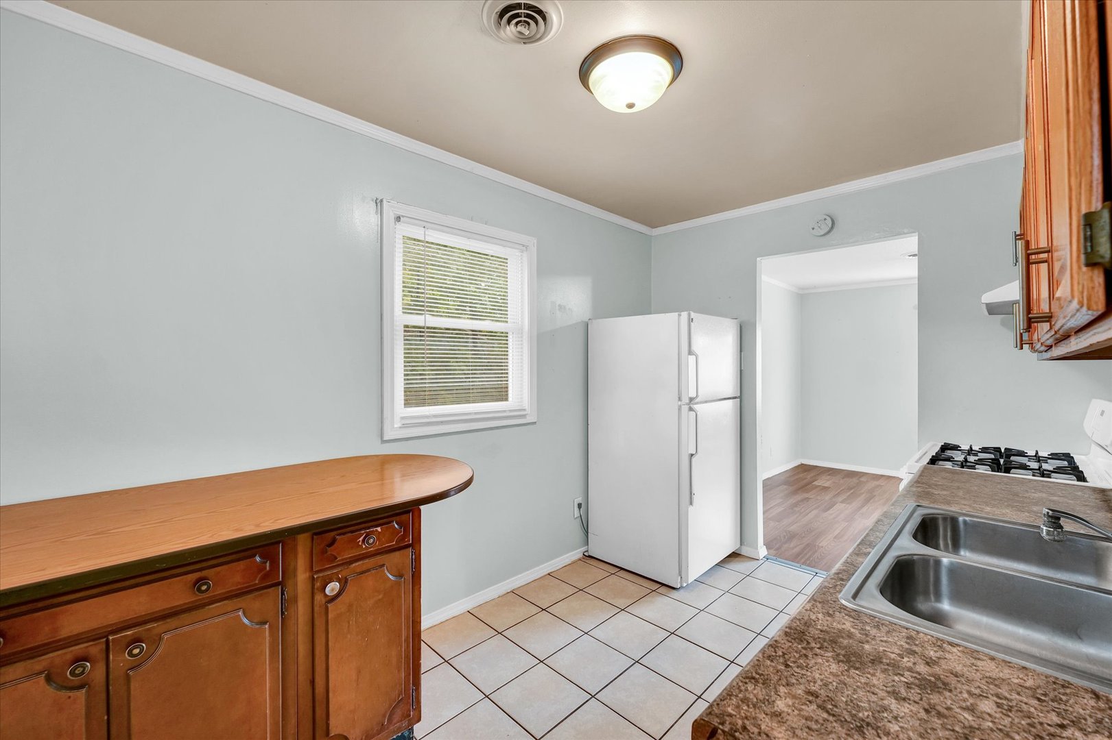 1345 Sunset Drive Rantoul, IL 61866 - Photo 10 of 22 a kitchen with stainless steel appliances granite countertop a refrigerator and a sink