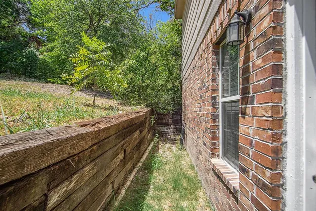 a view of a yard from a balcony