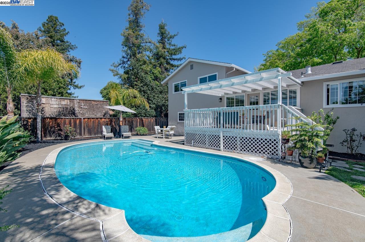 a view of a swimming pool with a patio