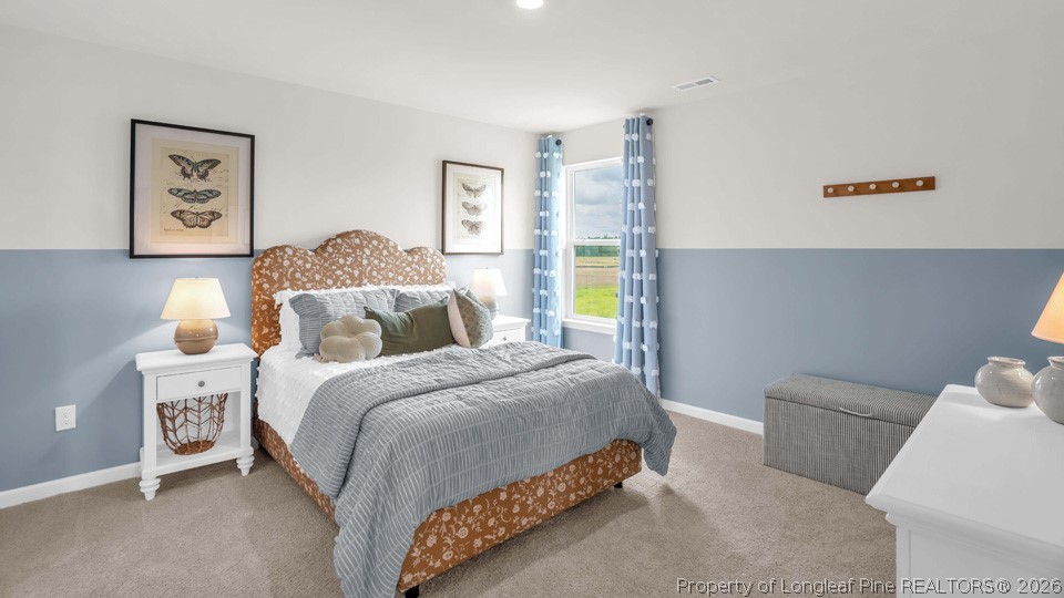 143 Rashford Way Raeford, NC 28376 - Photo 24 of 33 a bedroom with a bed and a couch