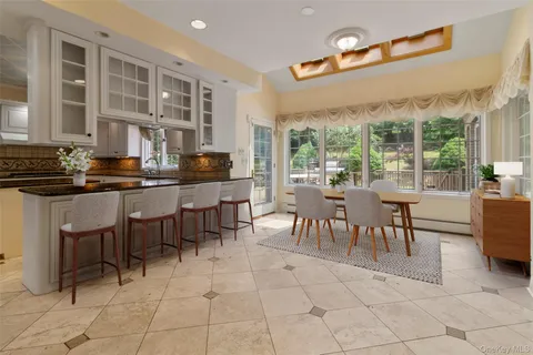 a view of a dining hall with furniture and chandelier