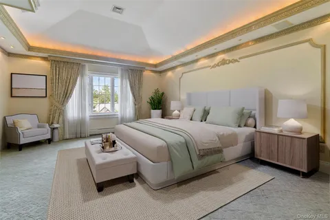 a bedroom with a bed couch and window