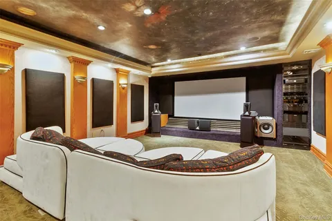 a room with lot of furniture and a chandelier