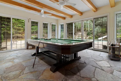 a room with furniture and large windows