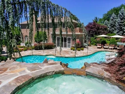 an outdoor space with garden and patio