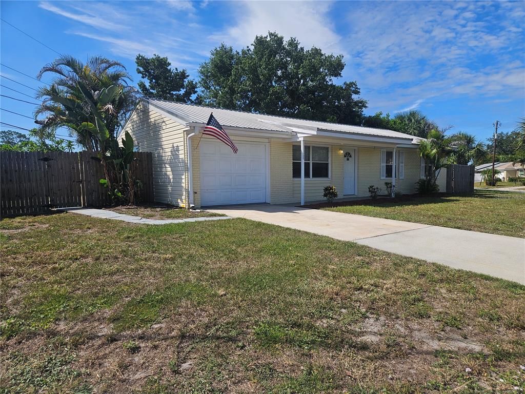 7000 Brentford Road Sarasota, FL 34241 - Photo 2 of 29 a view of a house with a yard
