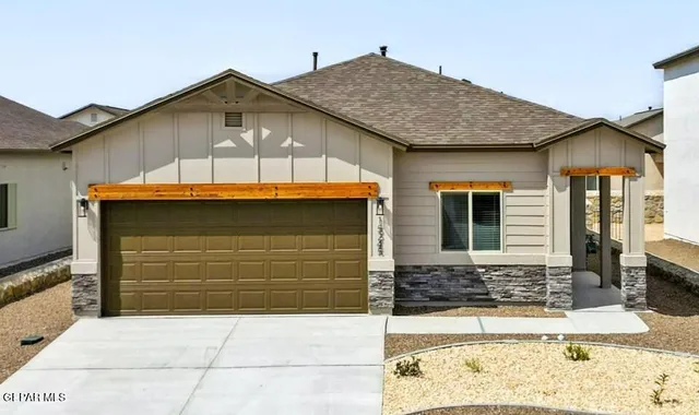 a front view of a house with a garage