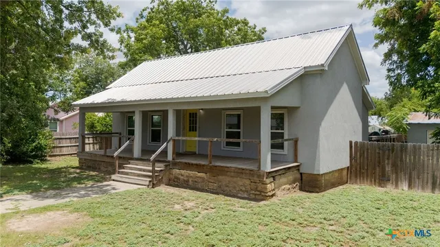 a house with yard in front of it