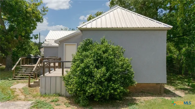 a view of a house with wooden fence
