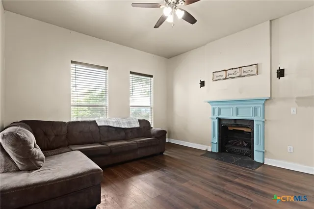 a living room with couches and a fireplace