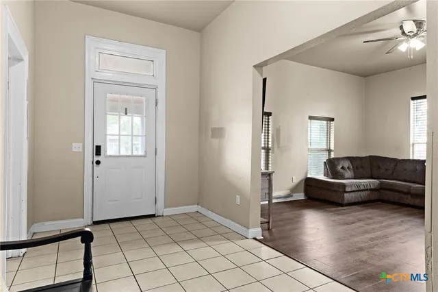 a living room with furniture and a window