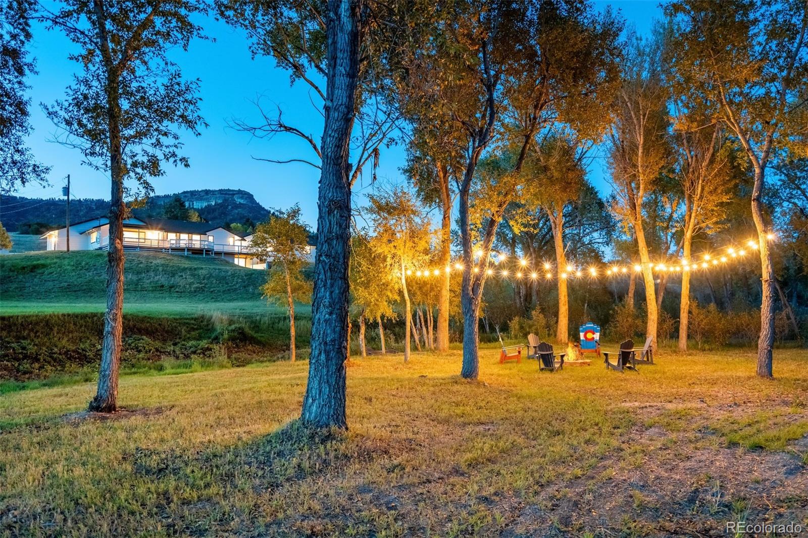 850 West Fox Farm Road Larkspur, CO 80118 - Photo 12 of 50 a view of a park with swings and a tables