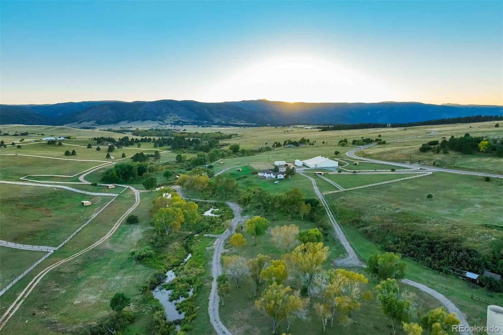 850 West Fox Farm Road Larkspur, CO 80118 - Photo 15 of 50 a view of a lush green field