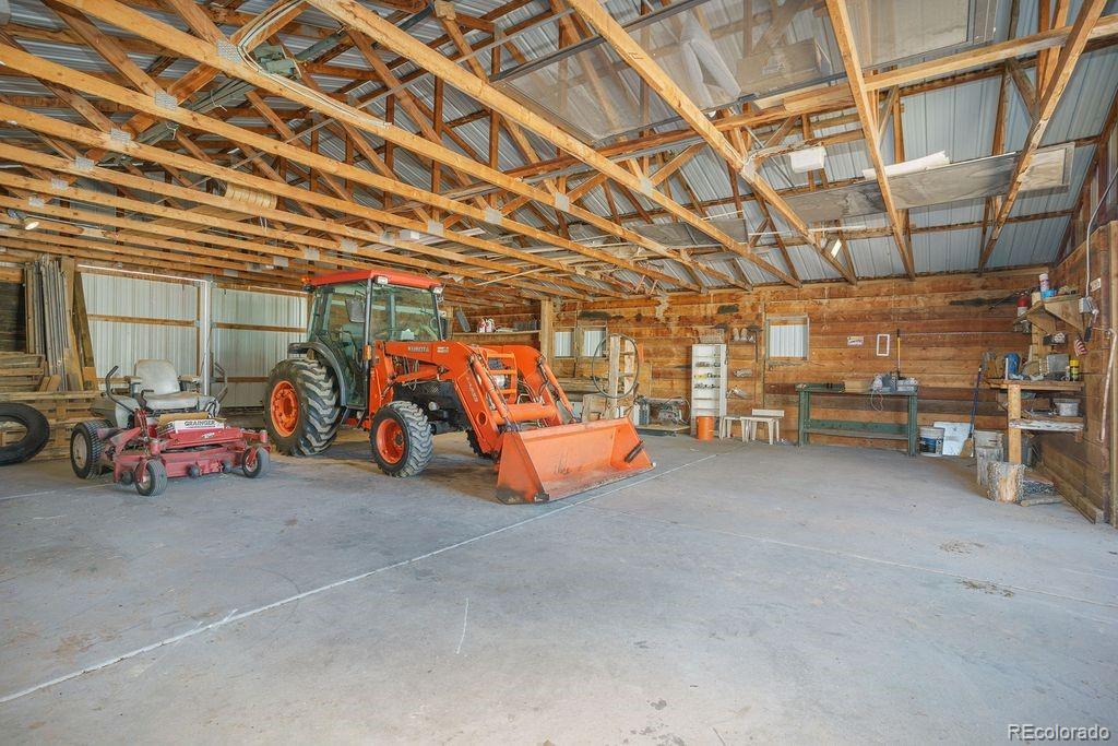 850 West Fox Farm Road Larkspur, CO 80118 - Photo 20 of 50 a view of parking garage with cars