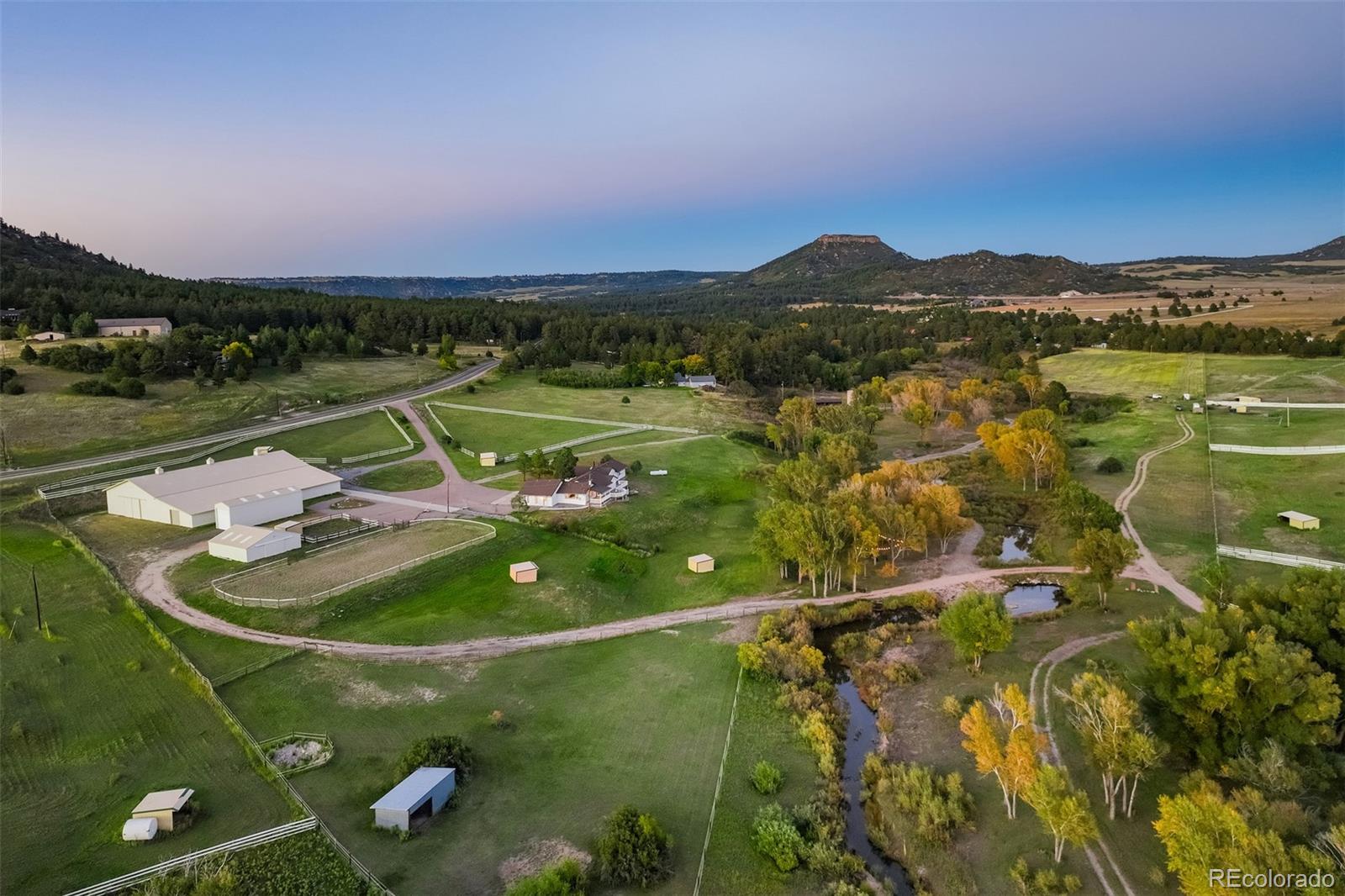 850 West Fox Farm Road Larkspur, CO 80118 - Photo 2 of 50 a view of a lake in middle of the town