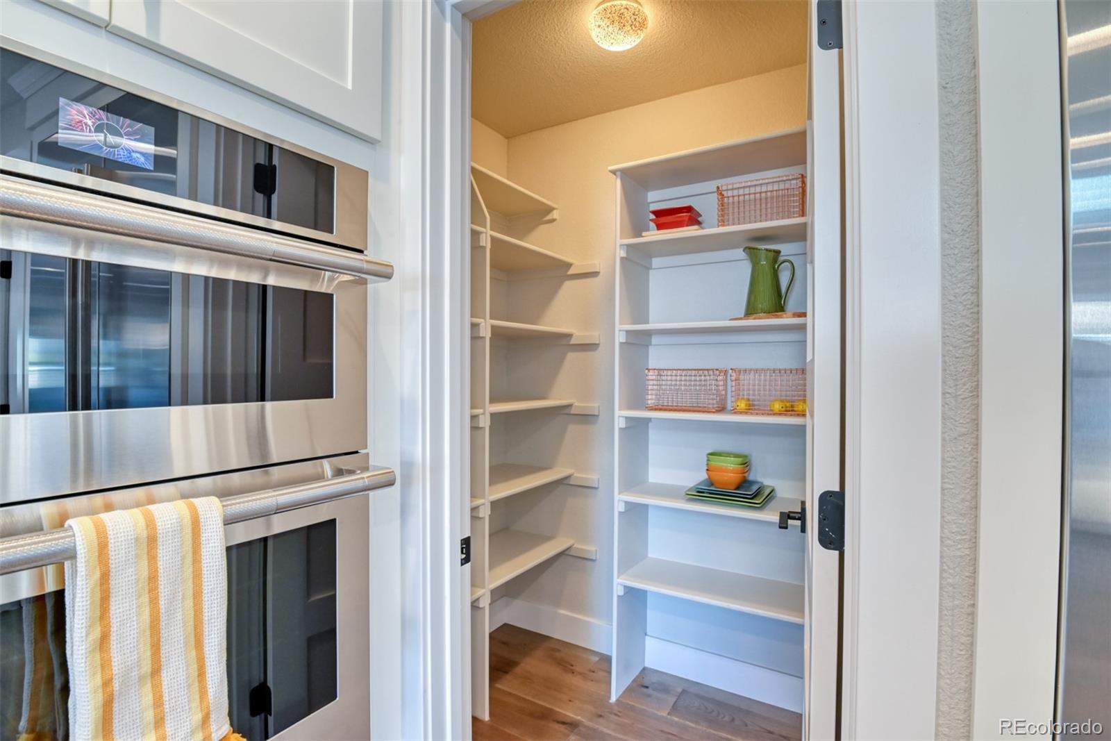 850 West Fox Farm Road Larkspur, CO 80118 - Photo 25 of 50 a view of an entryway with wooden floor