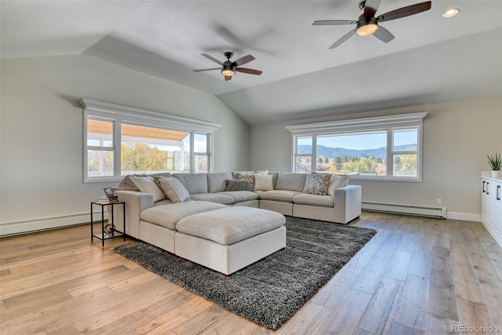 850 West Fox Farm Road Larkspur, CO 80118 - Photo 28 of 50 a living room with furniture and a window