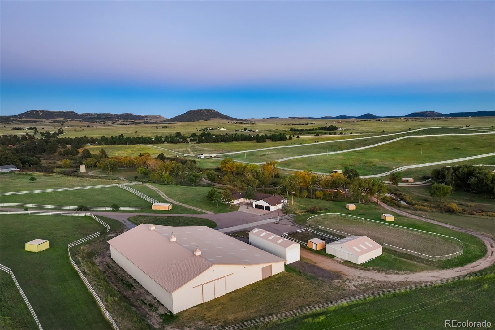 850 West Fox Farm Road Larkspur, CO 80118 - Photo 3 of 50 a view of a lake with a yard